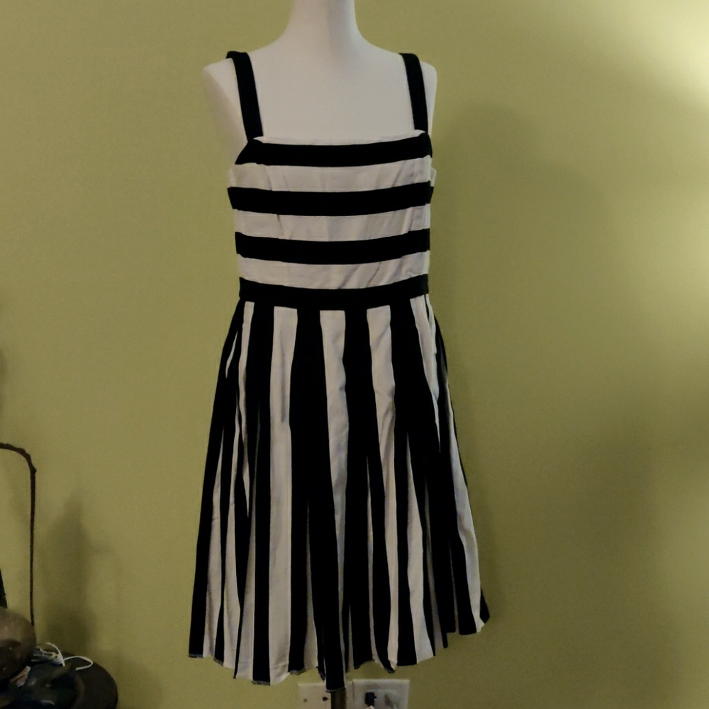 Black and white striped dress with pleated bottom